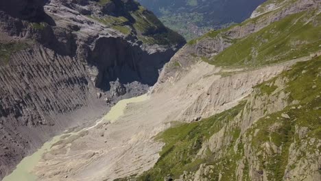 Aerial-shot-of-a-wild-transformed-valley-in-the-Swiss-alps-in-the-Grindelwald-region
