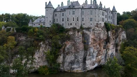 Drone-flying-toward-an-imposing-European-castle-perched-on-a-cliff