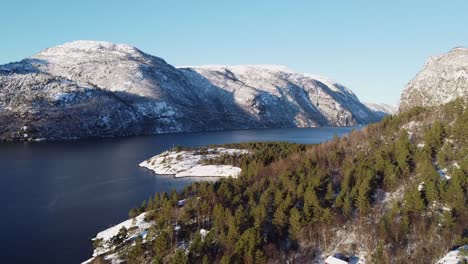 Aerial-revealing-Tettaneset-at-Stanghelle-and-Veafjorden---Norway-winter