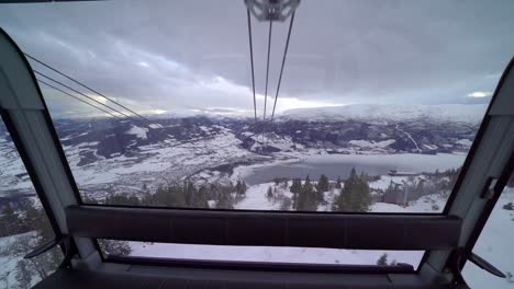 View-from-the-inside-of-dangling-gondola-cabin-in-windy-weather