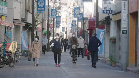 Japanese-Locals-In-Medical-Mask-On-The-Street-On-New-Year-Day-During-Pandemic-In-Tokyo,-Japan