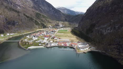 Norways-richest-municipality-Modalen---Aerial-approaching-town-centre-from-the-sea