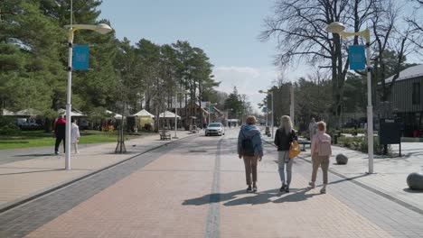 Basanaviciaus-Central-Pedestrian-Street-of-Palanga-With-People-Walking-on-Sunny-Afternoon