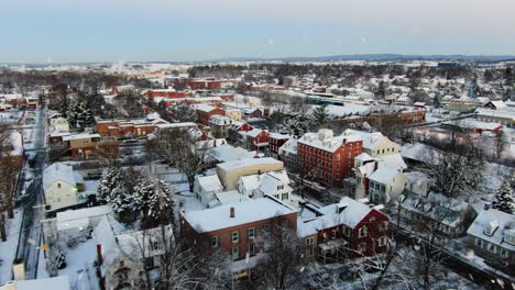 AERIAL-Over-Snow-Topped-Roofs-Of-The-Township,-Lititz-Pennsylvania,-USA
