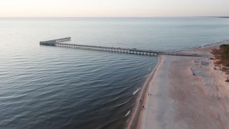 AERIAL:-Palanga-Bridge-and-Sandy-Beach-with-Calm-Baltic-Sea-on-Lovely-Evening