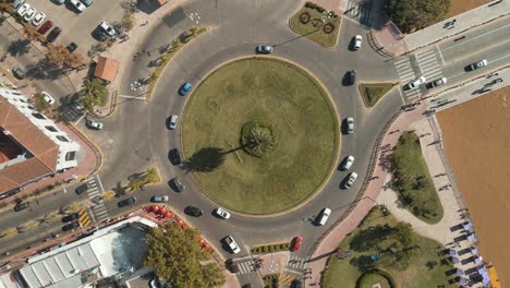 Aerial-view-of-daytime-traffic-of-a-roundabout-sited-in-Tigre-city,-Buenos-Aires