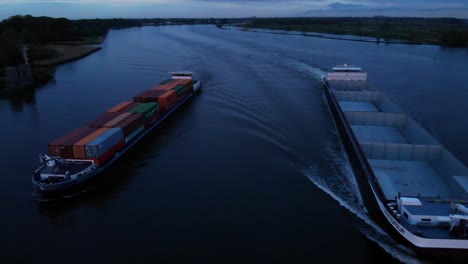 Container-Ships-Of-Factofour-Sails-The-Calm-River-In-Barendrecht