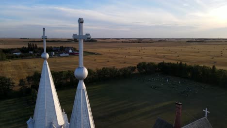 Aerial-footage-of-St-Peters-roman-catholic-church-in-American-prairie-during-sunset