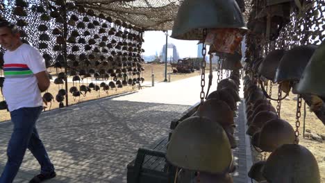 Dead-Armenian-soldiers-helmets-hang-on-display-in-Trophy-park,-Baku,-Azerbaijan
