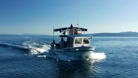 Fishermen-On-Fishing-Boat-Sailing-On-Adriatic-Sea-At-Daytime-In-Croatia