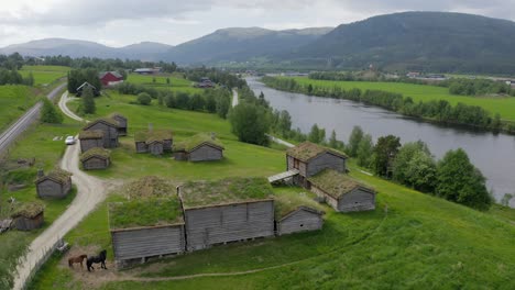 Aerial-view-over-traditional-Norwegian-cottages-has-green-roofs-in-tynset-town-in-Norway-on-June-25,-2021