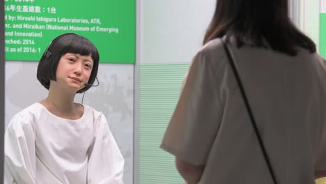 A-visitor-looks-at-the-Japanese-'Kodomoroid'-robot-during-the-'ROBOTS'-exhibition-at-the-Hong-Kong-Science-Museum-in-Hong-Kong