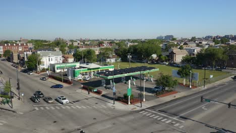Aerial-Establishing-Shot-of-BP-Gas-Station-in-Urban-Neighborhood-during-Daytime