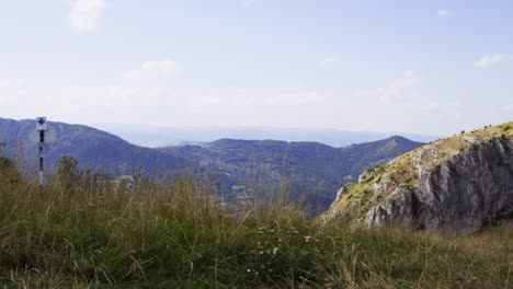 View-Of-The-Valley-Below-Piatra-Secuiului-Peak,-Alba,-Romania---panning-shot