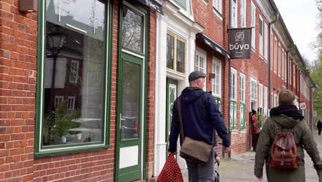 People-Walking-in-Dutch-Quarter-of-Potsdam-next-to-Traditional-Brick-Houses