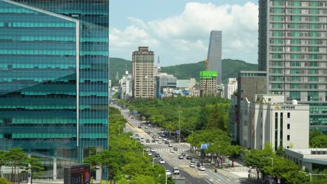 Daejeon-main-street-traffic-from-high-point-of-view,-City-Road-With-High-rise-Buildings-In-Foreground-,-South-Korea