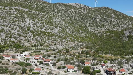 Slide-over-village-at-the-foot-of-the-mountain,-Seoca,-near-Omis,-Croatia
