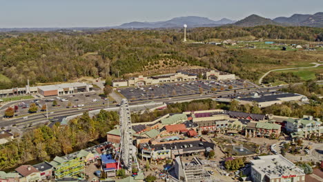 Pigeon-Forge-Tennessee-Aerial-v5-pedestal-orbiting-shot-above-famous-the-island-theme-park,-capturing-city-traffics-and-mountainous-landscape---Shot-with-Inspire-2,-X7-camera---November-2020
