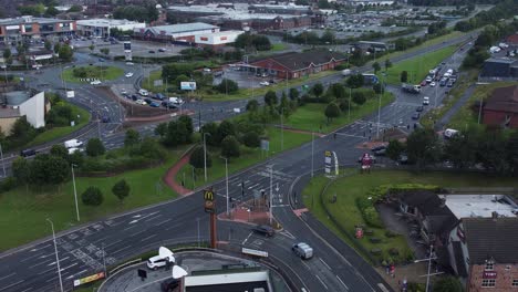 Aerial-view-above-busy-northern-British-shopping-retail-car-park-store-traffic-shops