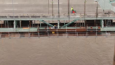 DRONE-SHOT-OF-CONSTRUCTION-WORKERS-ON-HERNANDO-DE-SOTO-BRIDGE