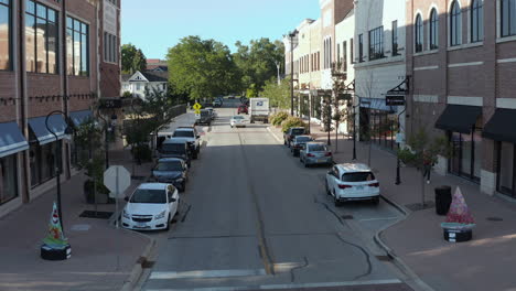 Pan-left-aerial-drone-shot-of-street-of-Naperville,-Joliet-city-in-Illinois