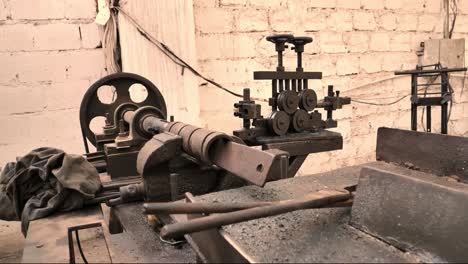 Vintage-Rusty-Lathe-In-Factory-Workshop.-Dolly-Back