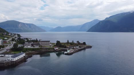 Lighthouse-out-on-headland-in-Leikanger-Sognefjord-Norway---Aerial