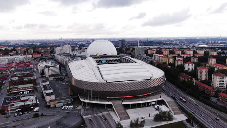 Cinematic-aerial-shot-of-Tele2-arena-and-Stockholm-cityscape