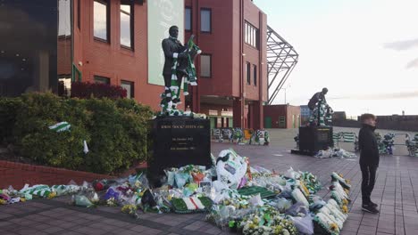 A-wide-shot-of-two-statues-of-Celtic-FC-legends,-Jock-Stein-and-Jimmy-Johnstone