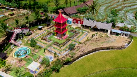 Scenic-aerial-view-on-flower-themed-park-Taman-Bunga-Pagoda-amid-rice-terraces