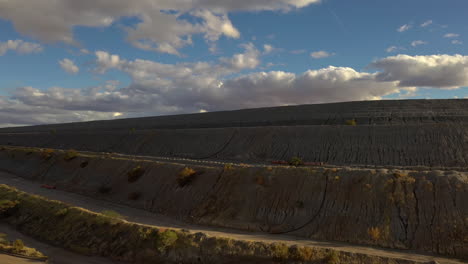 Huge-mine-pilings-in-Arizona,-drone-ascend-reveal