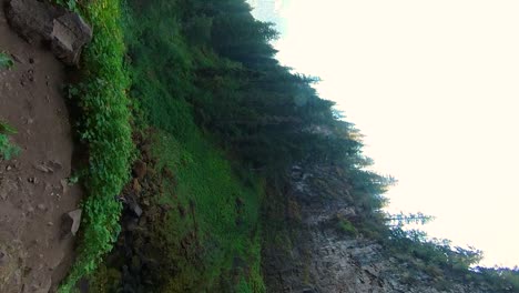 Mobile-shot-of-a-high-pan-over-a-waterfall-in-Oregon