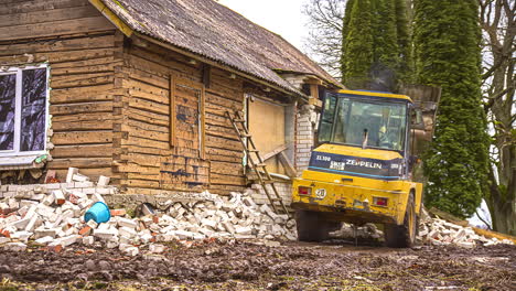 Time-lapse-shot-of-german-Zeppelin-Digger-in-motion-demolished-facade-of-old-wooden-house-on-rural-farmland