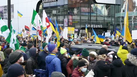 Protestors-gather-and-wave-flags-to-show-support-for-Ukraine