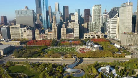 Birds-Eye-Aerial-View-of-Millennium-Park,-Cloud-Gate-on-Fall-Day