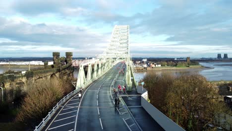 Charity-Santa-dash-fun-run-over-Runcorn-Silver-Jubilee-bridge-Aerial-view-low-static-shot