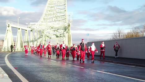 Slow-motion-Charity-Santa-dash-festive-fun-run-across-Runcorn-Silver-Jubilee-bridge