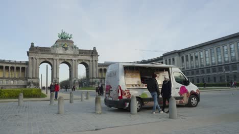 The-Belgian-Waffle-and-Ice-Cream-Truck,-Food-Van-Selling-Hot-Waffles-and-Ice-at-the-Jubelpark-in-Brussels,-Belgium---Wide-angle