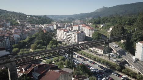 Aerial-of-Redondela-city-with-the-train-bridge-on-a-sunny-summer-day-in-Pontevedra,-Galicia