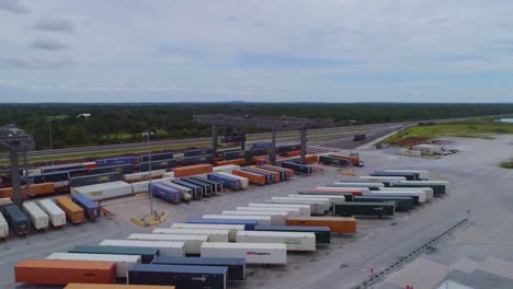 4K-Drone-Video-of-Trains-and-Trucks-at-CSX-Intermodal-Train-Yard-in-Winter-Haven,-FL