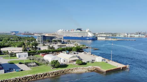Aerial-view-drone-shot-of-a-landscape-shot-of-bay-|-Cruise-ship-docked-on-port-in-bay-aerial-view