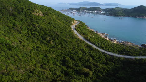 Coastal-landscape-of-Binh-hung-island,-road-and-boats-in-sea