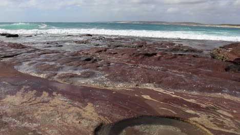 Kalbarri-Western-Australia,-Rock-Pools-With-Waves-Crashing,-Pan-Right