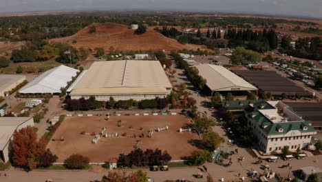 Aerial-flying-over-a-show-jumping-competition-at-the-Murieta-Equestrian-Center-in-Sacramento,-California