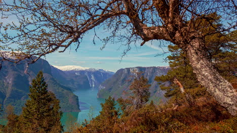 Overview-of-scenic-Geirangerfjord-between-mountains-with-Waterfalls-in-Norway-on-a-beautiful-sunny-morning-in-timelapse