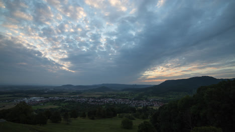 Night-to-day,-sunrise-time-lapse-shot-at-Swabian-Alb-in-summer