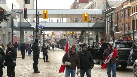 Freedom-Convoy-Protestors-on-Ottawa-street,-People-and-cars-on-road-blockage