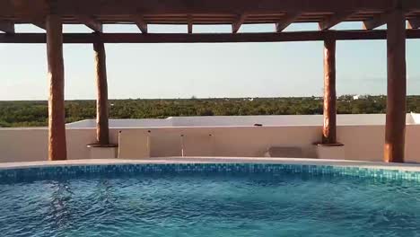 Private-pool-on-a-rooftop-in-a-beach-apartment,-jungle-Quintana-Roo
