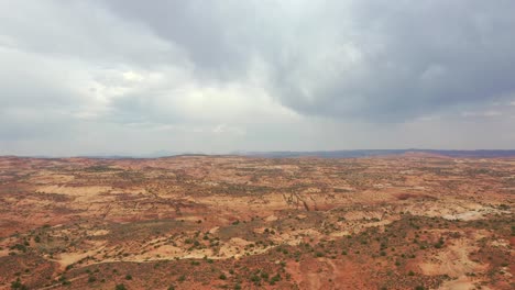 Landscape-With-Colorful-Meadow,-Grand-Staircase-Escalante-National-Monument,-Utah-On-A-Cloudy-Day---aerial-drone-shot