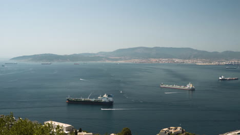 Large-fishing-and-cargo-boats-in-Gibraltar-bay-harbor,-panoramic-shot
